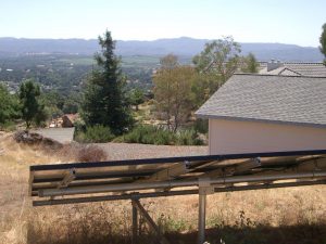 solar panels with mountains in the background