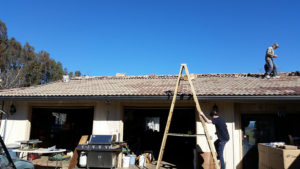 solar panel hardware being installed on a roof