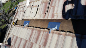 solar panel hardware being installed on a roof