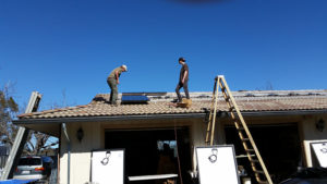 solar panel hardware being installed on a roof