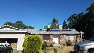 solar panels being installed on a roof