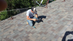 hardware being installed on a roof, getting ready for solar panels