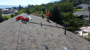 hardware being installed on a roof, getting ready for solar panels