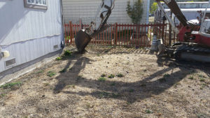 a backhoe that is digging a trench