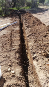 a large trench with brush