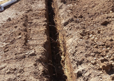 a large trench with brush