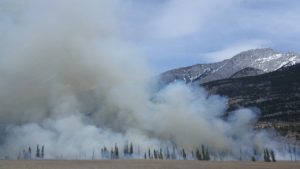 landscape that is smoking from wildfire